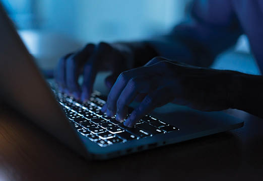 A person typing on a computer