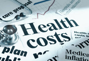 Newspaper clippings of healthcare cost headlines