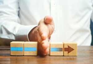 A hand blocking block arrows