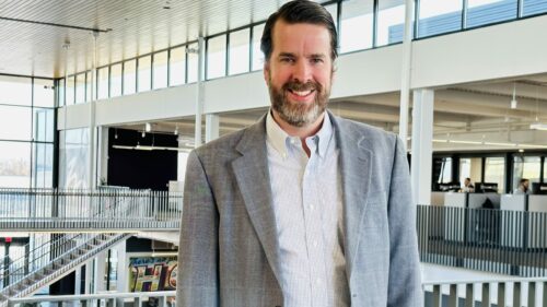 A professional photo of Andrew Patton in an office.