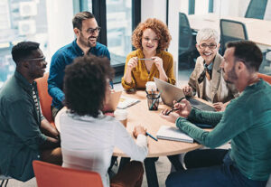 A group of professionals sitting around a table discussing insurance