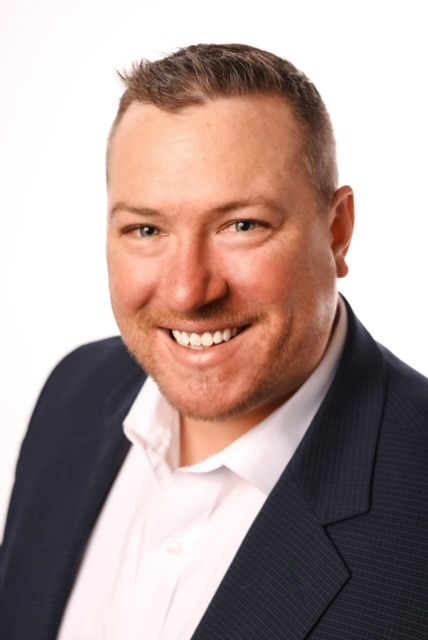 Michael Curtis smiling in a professional photo