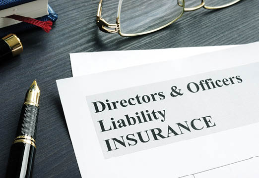 Directors and Officers Liability Insurance paperwork on a desk.