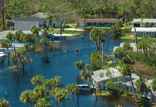 Houses, roads, cars underwater and flooded.