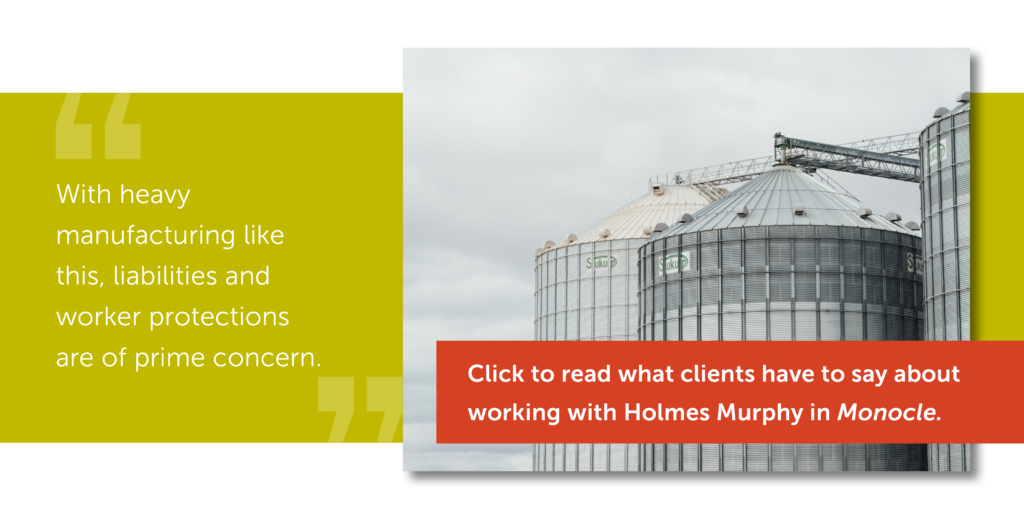With heavy manufacturing like this, liabilities and worker protections are of prime concern. Click to read what clients have to say about working with Holmes Murphy in Monocle. Silos against a grey sky.