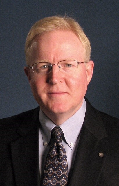 A professional photo of Tim Anders, a blonde older man.