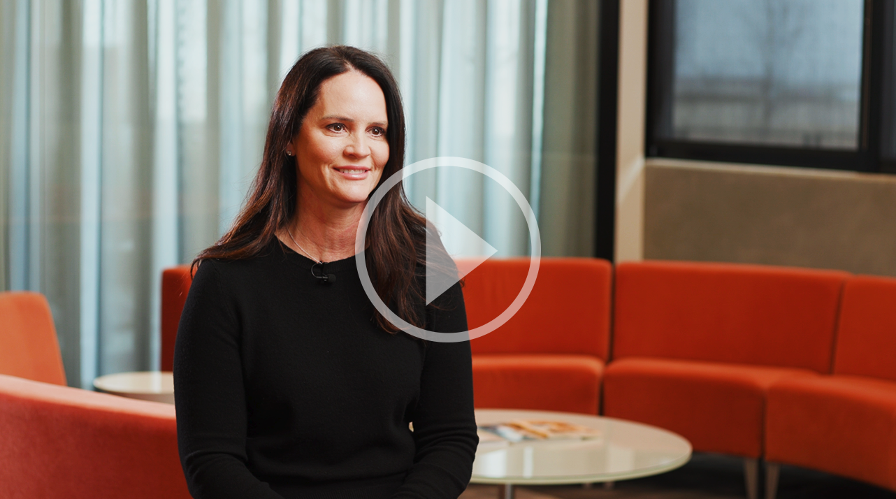 A video thumbnail of Tricia Wilson, a brunette woman in a simple dark shirt.