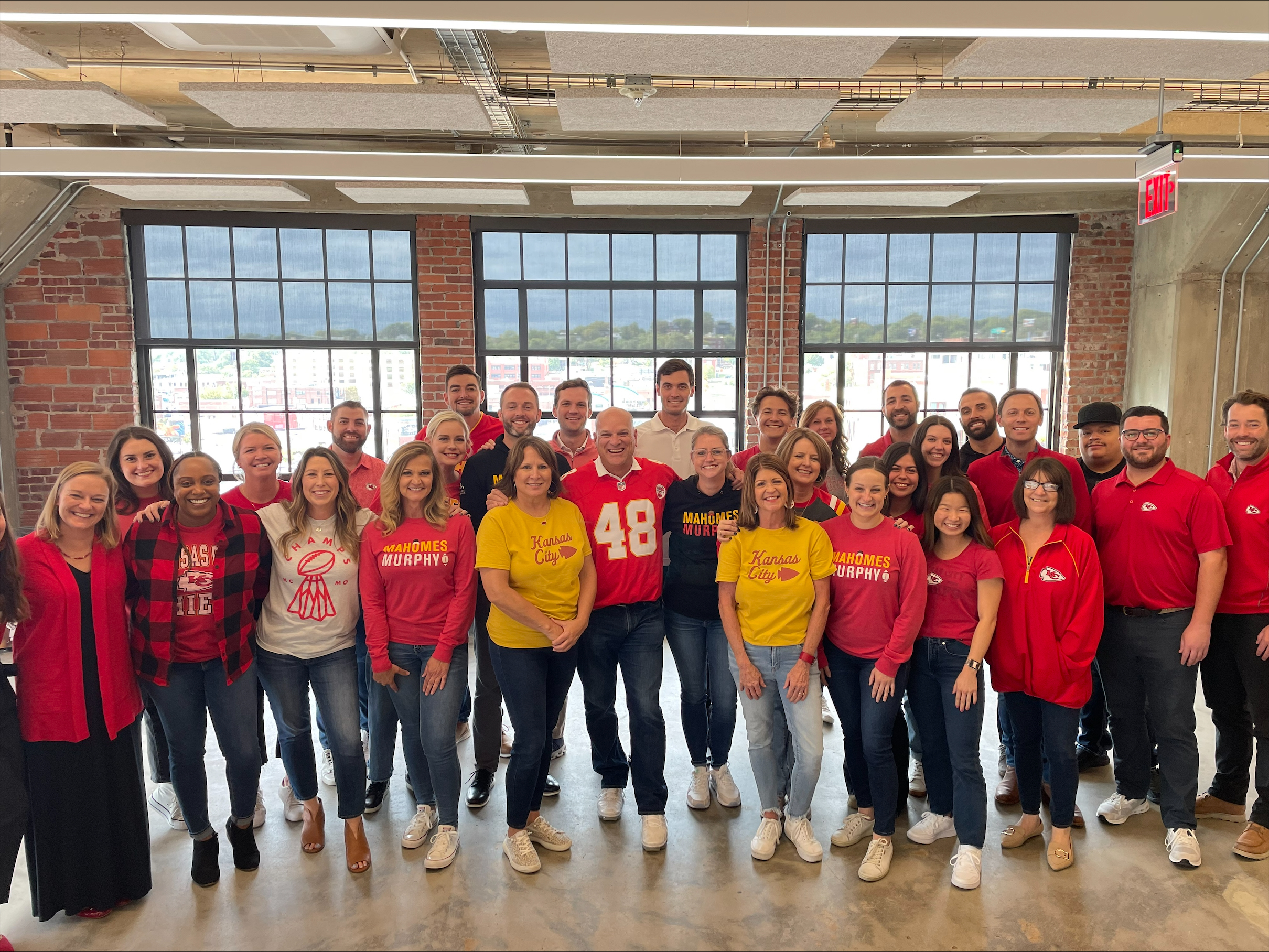 Holmes Murphy Kansas City employees wearing their football team gear during 2023 United Way week.