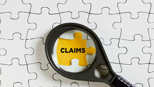 white puzzle pieces. A yellow puzzle piece is in the middle with the word 'claims' on it.