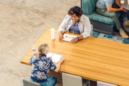 Discussion between two employees in Holmes Murphy's Soul Central