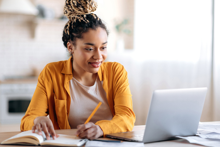 A woman typing on a computer