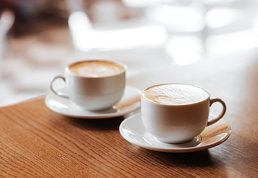 Two coffee cups on a table