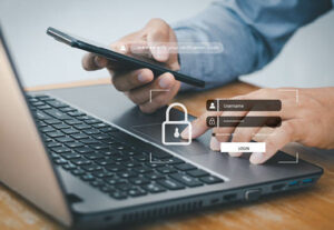 A business man logging into his computer using multi-factor authentication