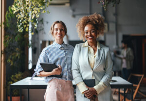 Two business women in a office.