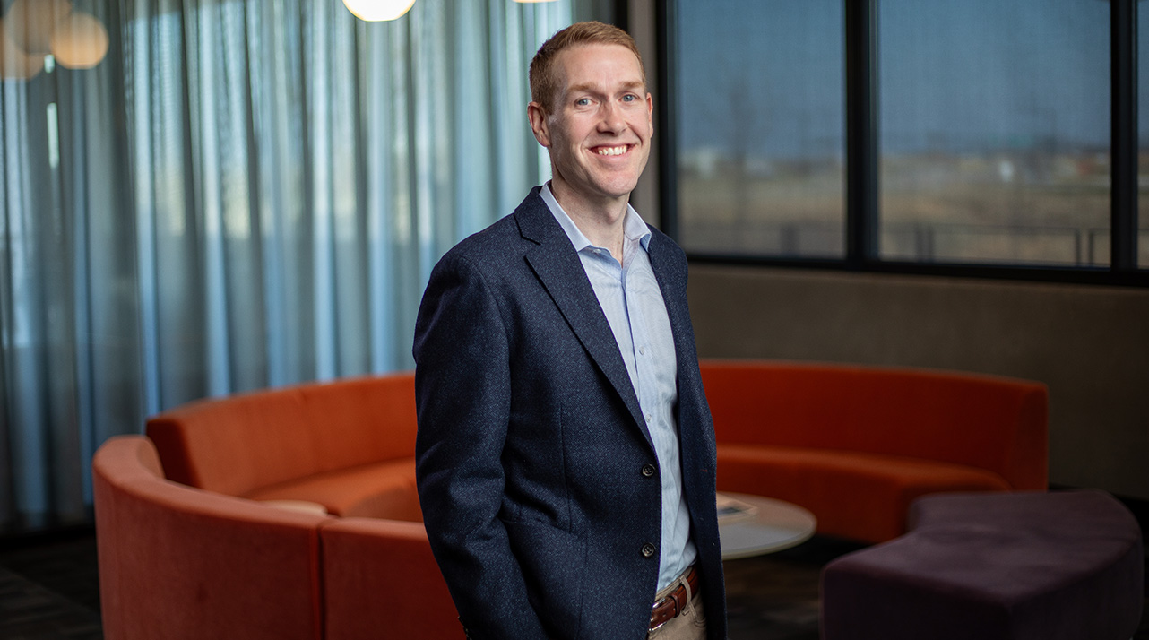 Sean O'Hare in a business suit for a video