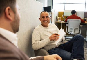 Two Holmes Murphy employees talking to each other.
