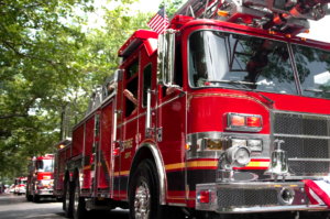 A firetruck driving down the street.