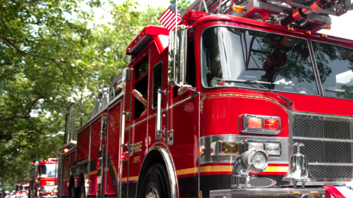 A firetruck driving down the street.