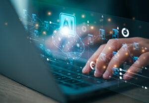 A person typing with AI graphics floating around them in the air