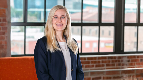 Molly Meek headshot in front of window