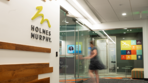 A person walks into a Holmes Murphy office.