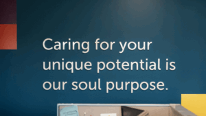 Text on a Holmes Murphy office wall stating "Caring for your unique potential is our soul purpose."