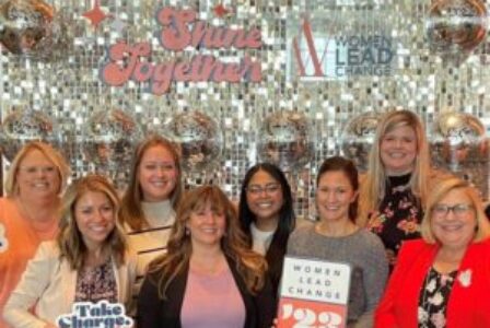A group of Holmes Murphy employees at a Women Lead Change conference
