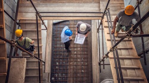 Four construction workers on a jobsite