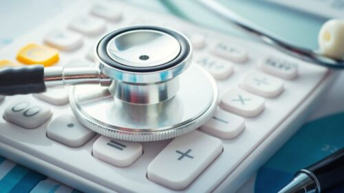 A stethoscope on a calculator