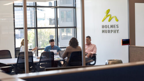 Holmes Murphy employees sitting in conference room